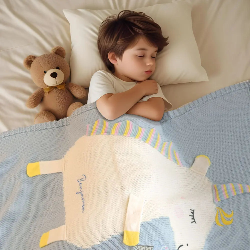 Unicorn motif on a gender-neutral baby blanket