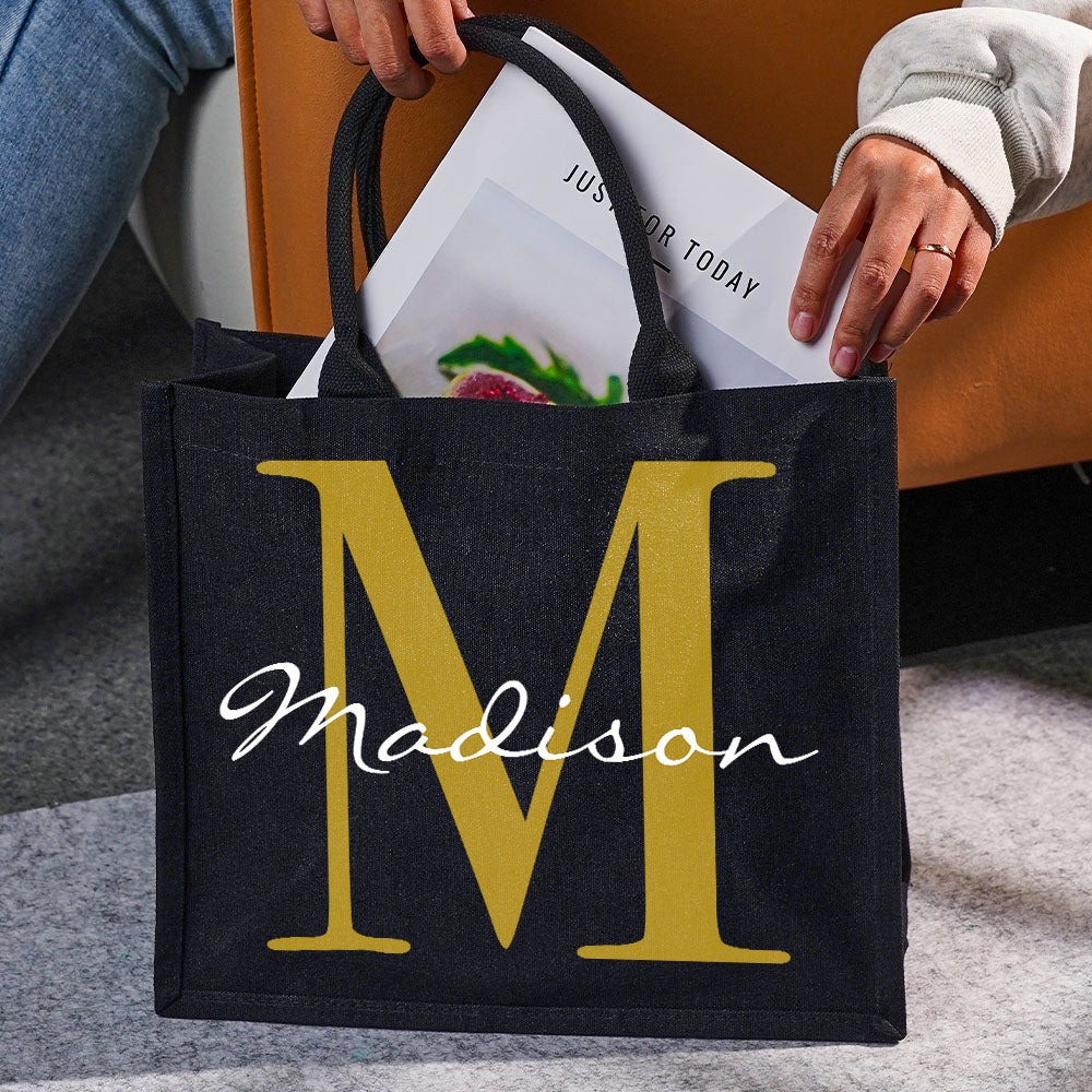 Interior view of personalised black canvas name and initial tote showing spacious main compartment ideal for daily essentials, books or shopping