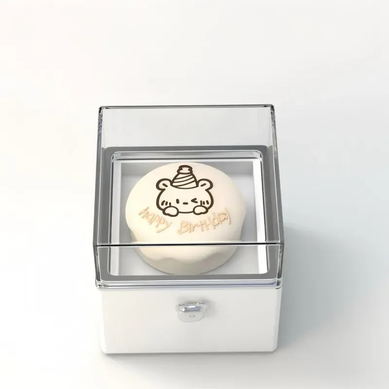 Scale shot of the Bear Cake Ring Box beside a ruler showing the compact 8×8cm dimensions — perfect for discreet surprise setups