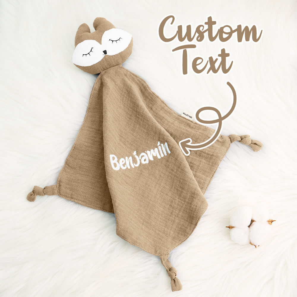 Close-up of towel corner and personalised embroidery, showing care-friendly cotton fabric and fine finishes — keepsake comforter for babies