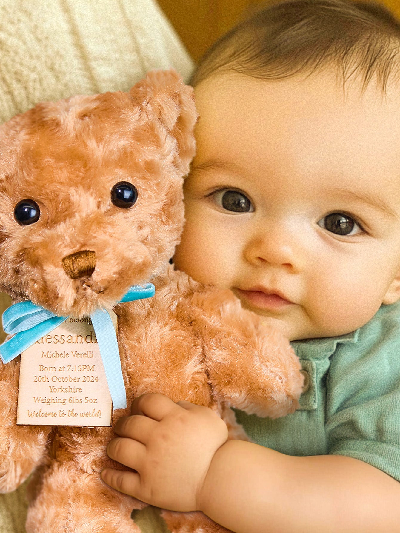 Personalised embroidered teddy displayed in a nursery setting — soft plush newborn keepsake and baby shower gift