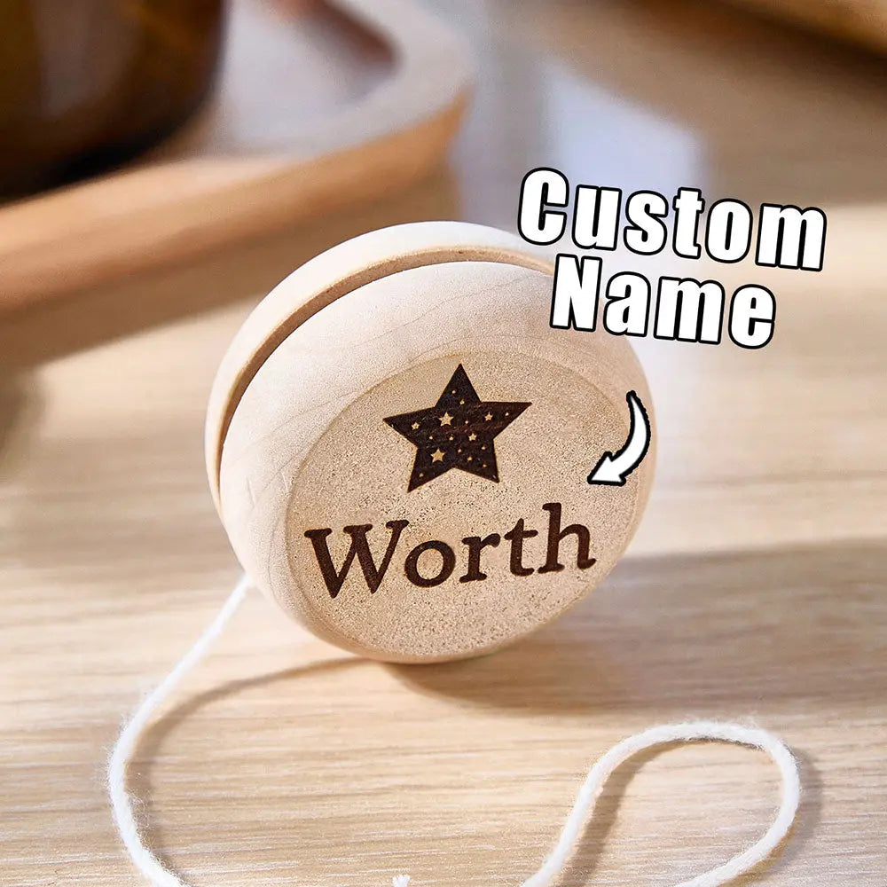 Wooden yo-yo beside a ruler showing 5.5cm diameter — compact personalised birthday gift and stocking filler