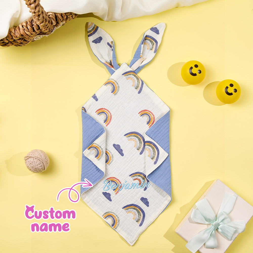 Small 30cm square baby comforter resting on a neutral surface.