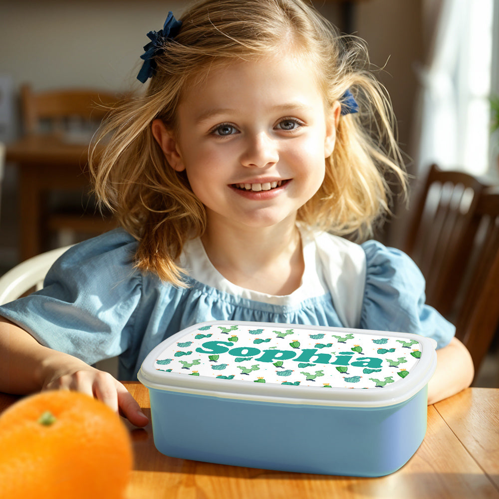 Lifestyle shot of personalised cactus lunch box packed with healthy snacks — perfect personalised gift for boys and girls at school