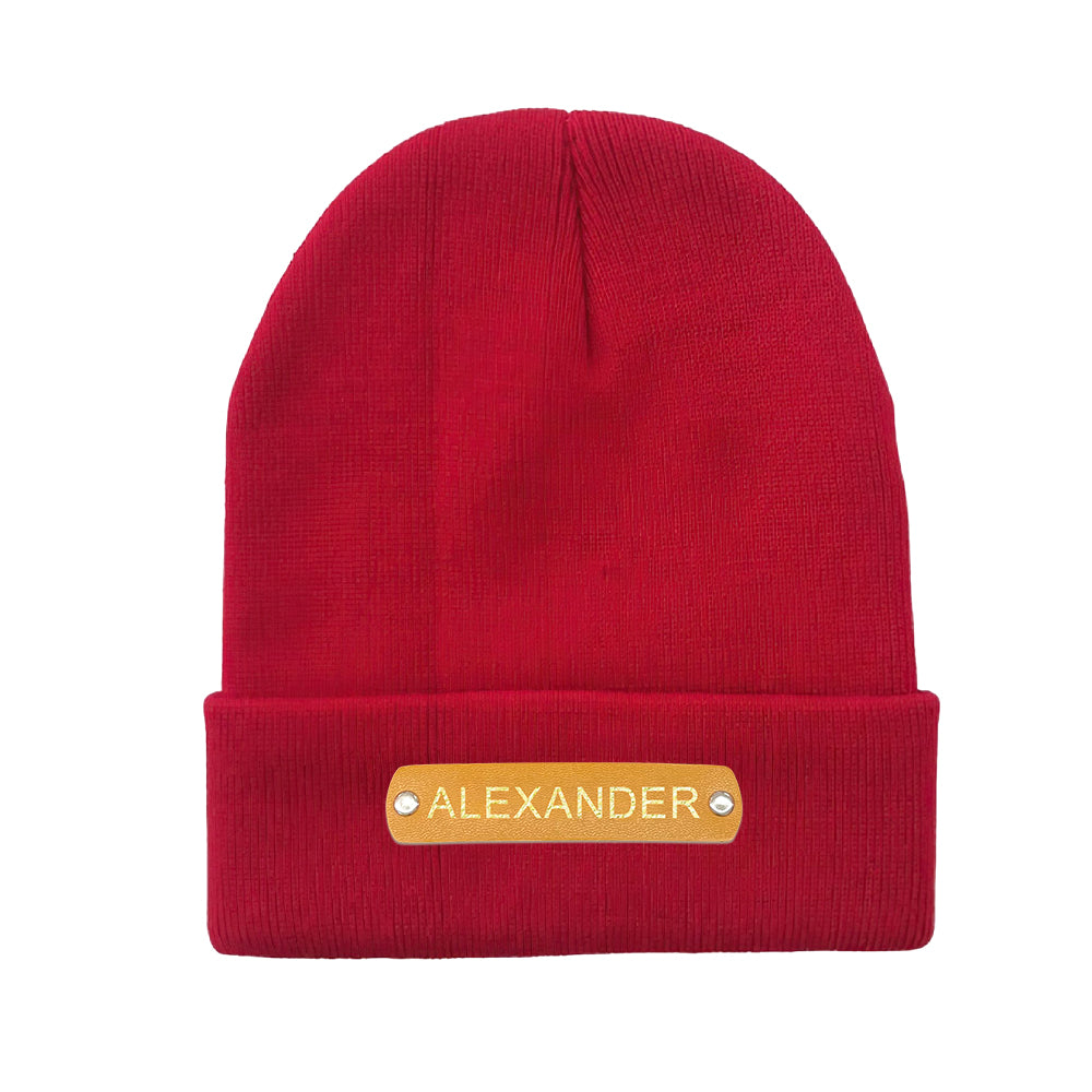 Handheld view showing lightweight portable personalised beanie with leather name patch, perfect for gifting and travel