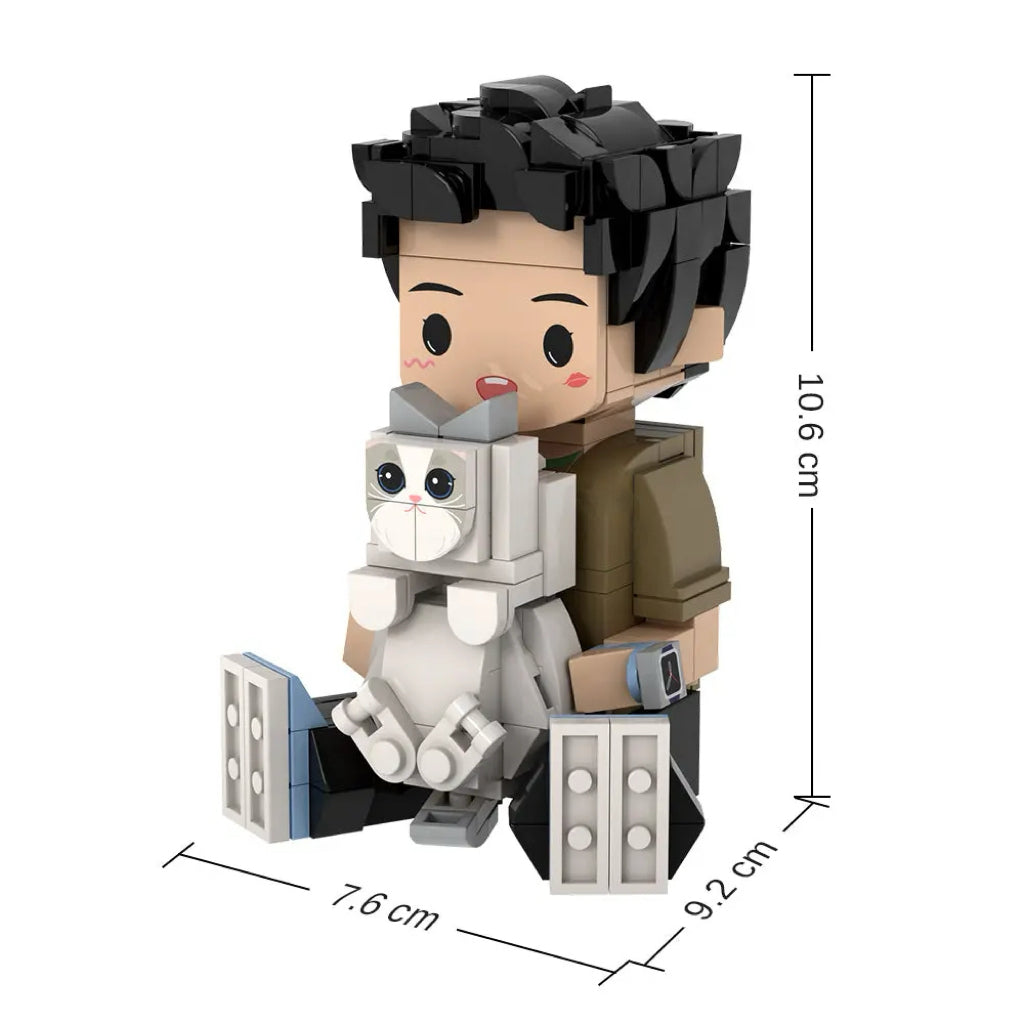 Close-up of facial detail on a personalised sitting brick figure — bespoke facial expression and hair recreated from a photo