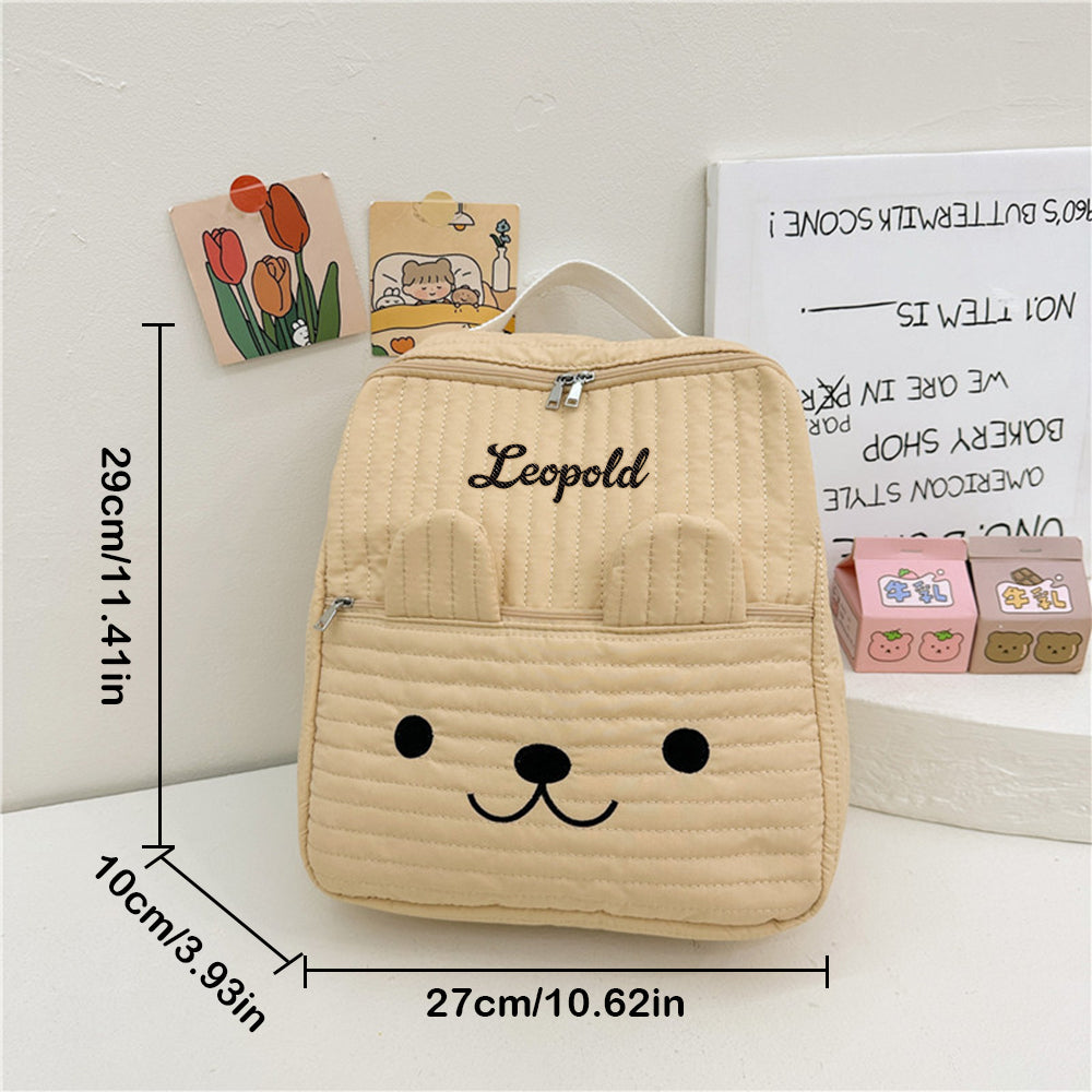Close up of embroidered name on durable canvas fabric — high quality personalised name embroidery detail for kids' backpack