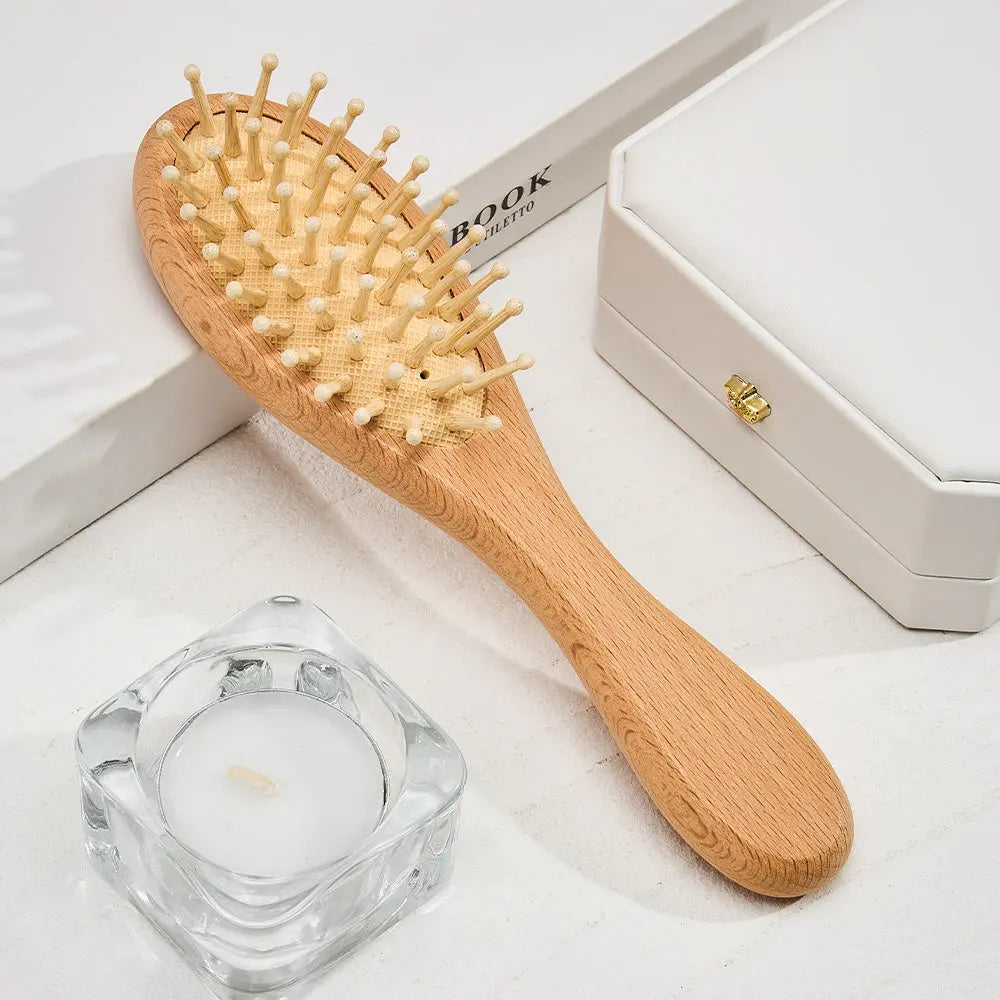 Detailed view of comb teeth with rounded edges to protect a delicate scalp — gentle wooden baby comb for newborn hair care