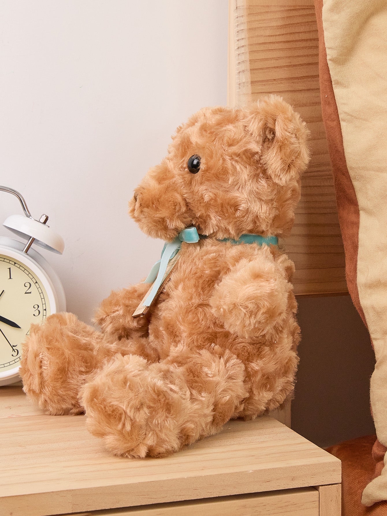 Side view of personalised birth announcement bear highlighting plush texture and PP cotton filling, 25cm x 24cm