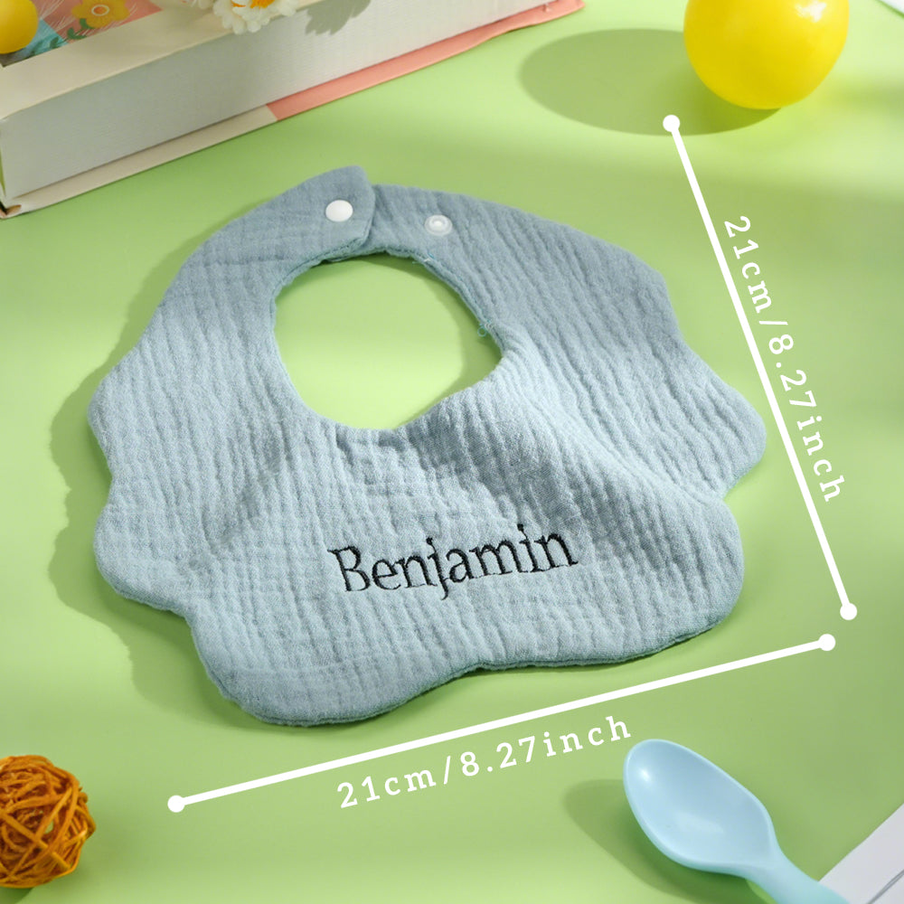 Flat-lay showing 21cm x 21cm measurement of a personalised cotton baby bib — size suitable for newborns and infants