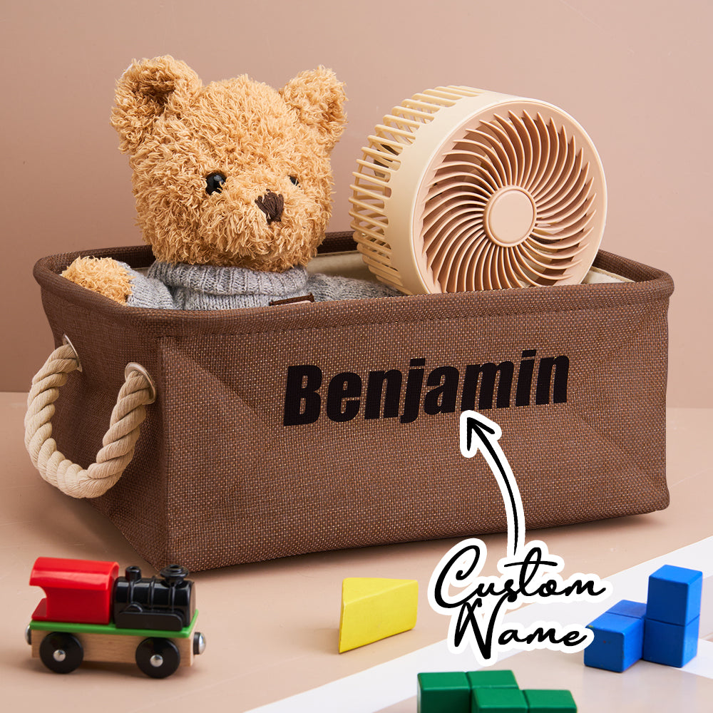Close-up of the linen texture and printed name on the personalised toy bin; handcrafted look.