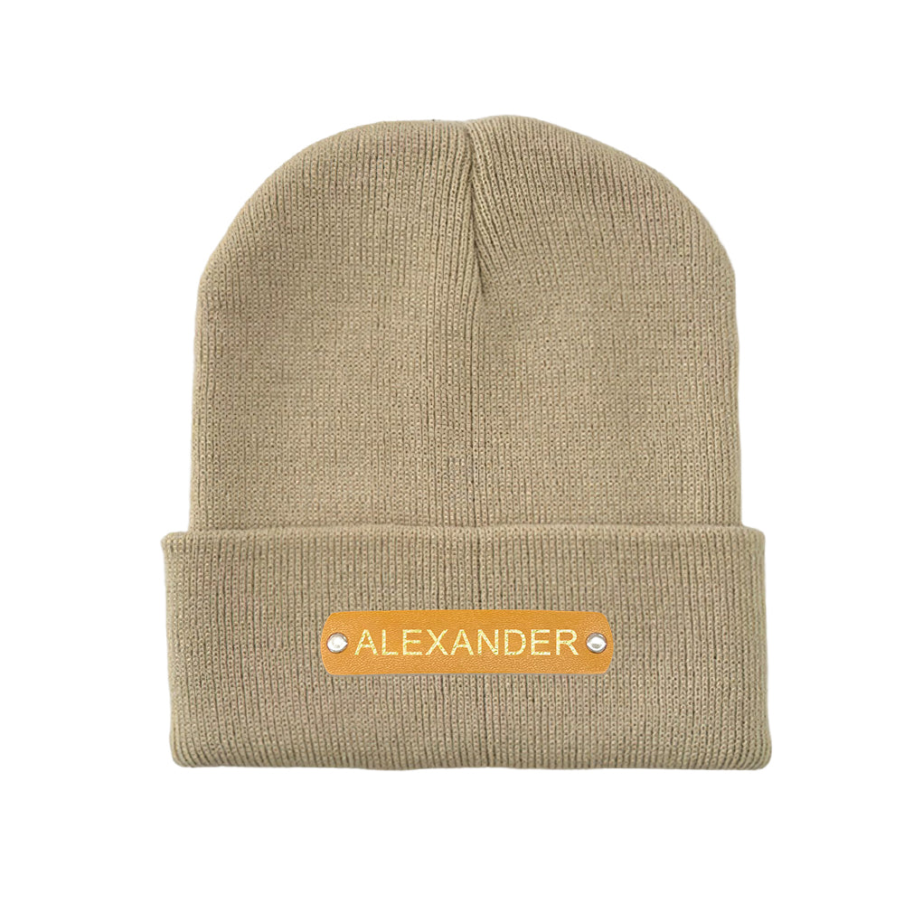 Outdoor portrait wearing a custom name winter hat with leather patch, cosy personalised beanie gift idea