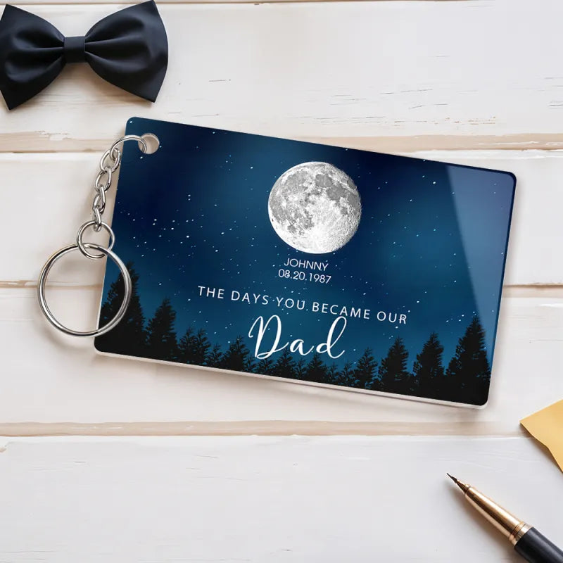 Close-up of engraved moon phase and crisp personalised text on the acrylic Personalised Starry Night keyring with metal split ring