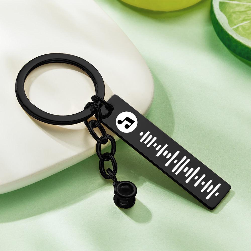 Scale and size comparison of personalised projection music code metal keychain – compact custom song keyring