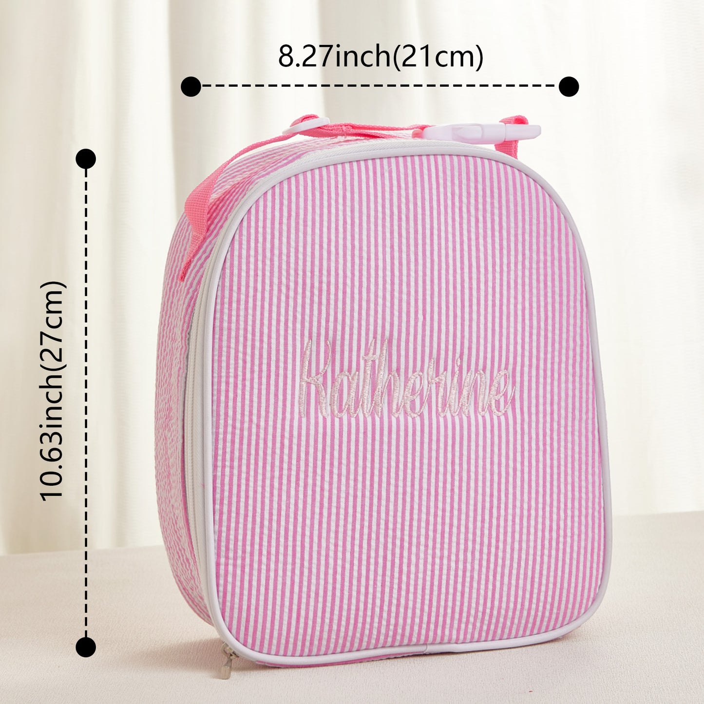 Collection of personalised seersucker lunch bags showing colour and pattern variations with embroidered names — great party gifts