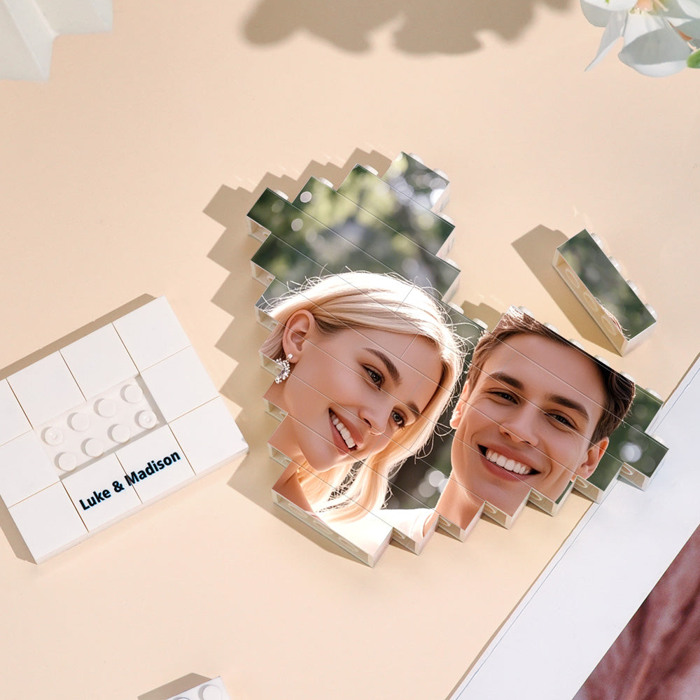 Unassembled custom brick puzzle pieces laid out to show the personalised photo split across the heart-shaped blocks — fun to assemble and display