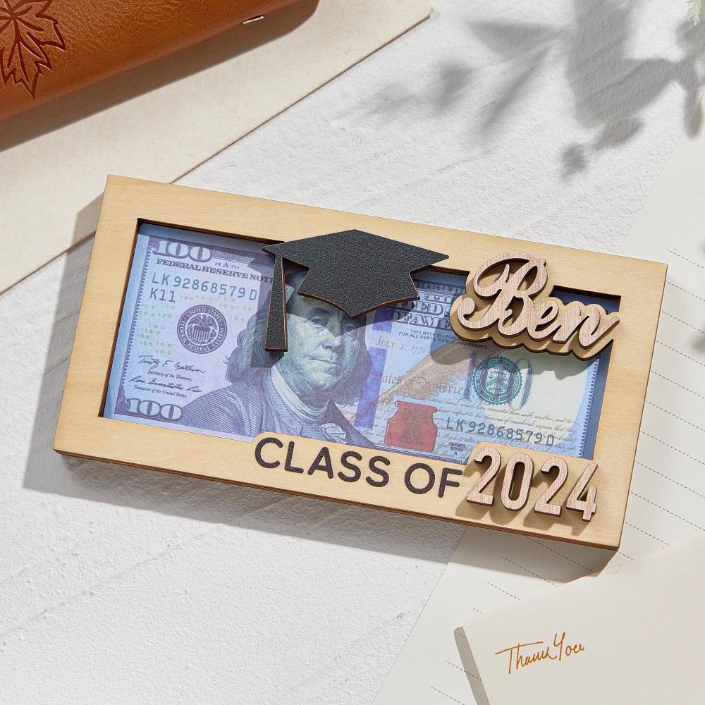 Close-up of precision engraving on personalised wooden money box showing customised name and date — ideal personalised graduation gift