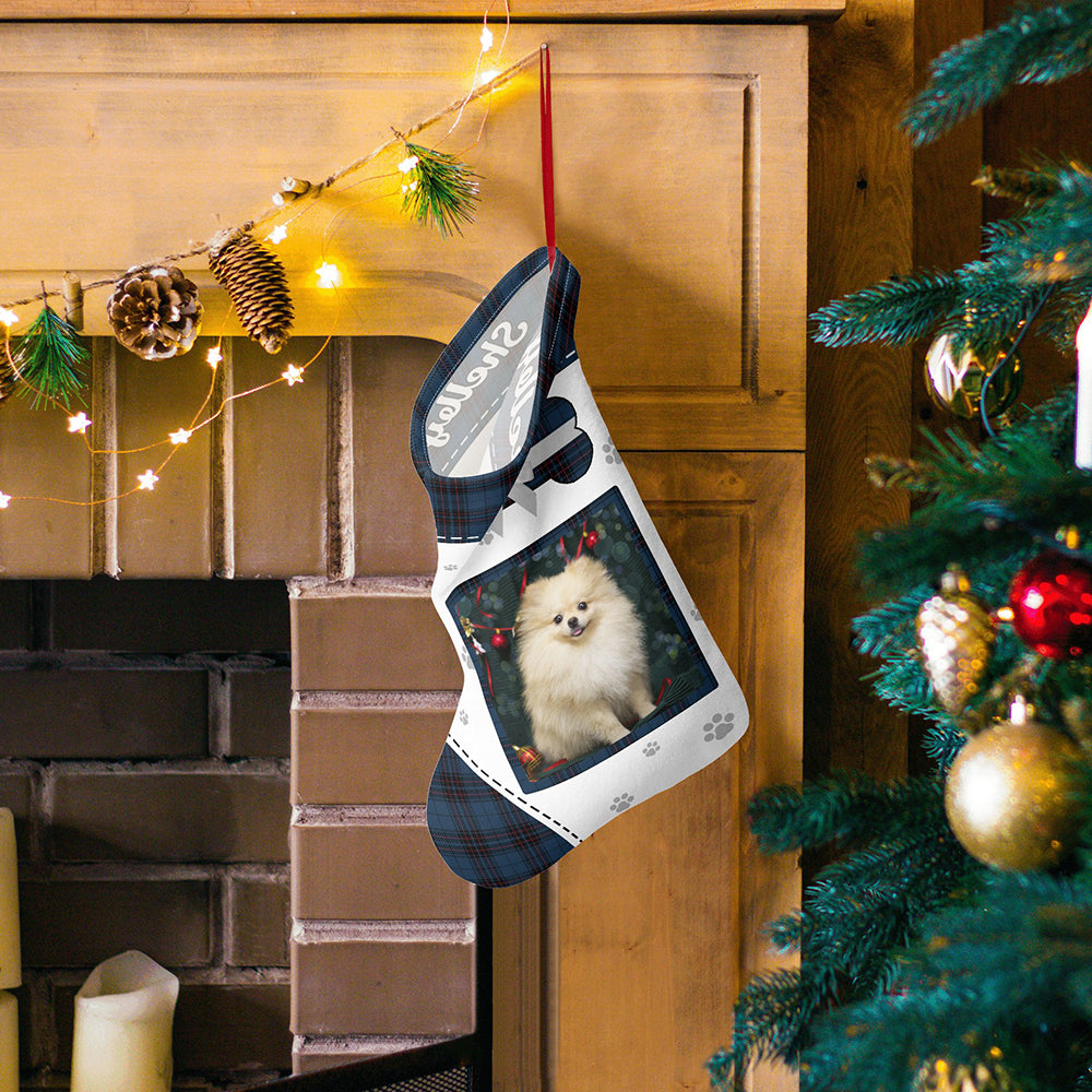 Assorted personalised pet photo stockings hanging together on hooks, each displaying different names and pet photos as festive keepsakes
