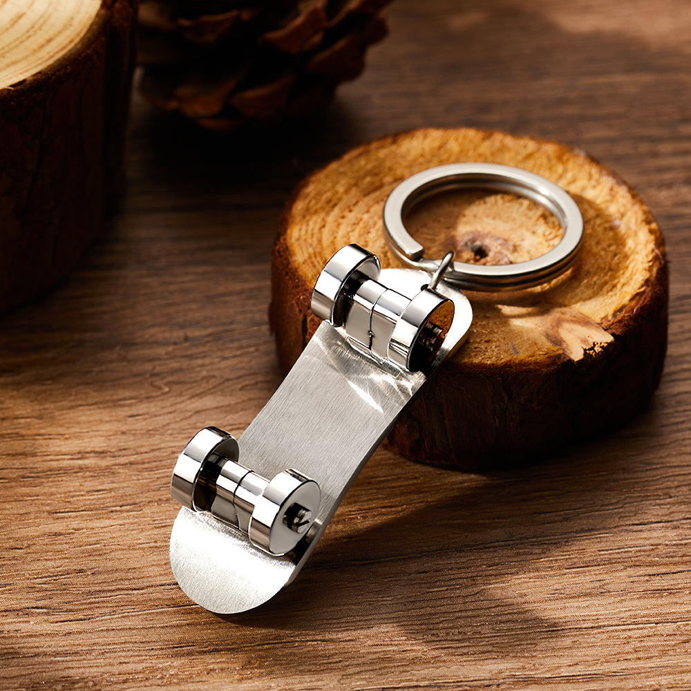 Personalised skateboard keyring with custom name engraving on brushed stainless steel deck — compact, durable keychain perfect as a personalised gift for skateboard enthusiasts