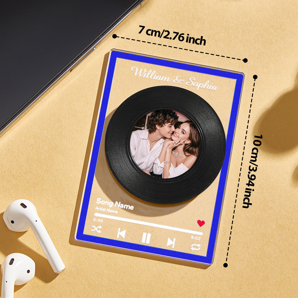 Personalised rotatable vinyl record plaque on a shelf beside books, illustrating compact 7cm×10cm size — ideal music gift