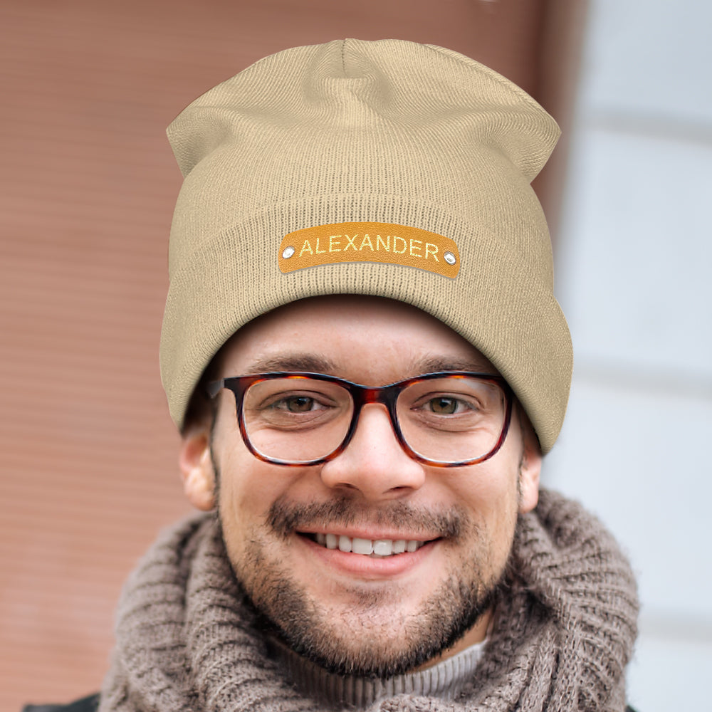 Assorted personalised knitted beanies displayed together to show colour choices and customisation options