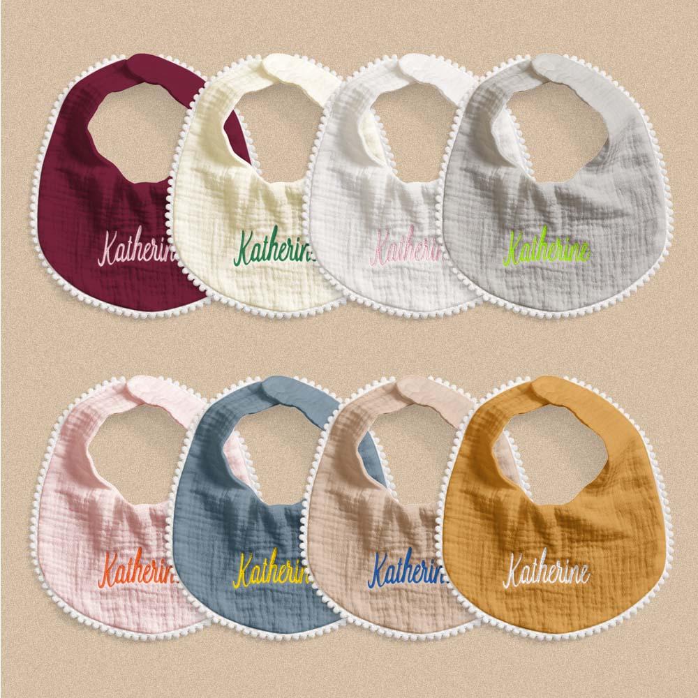 Rear view showing secure fastening and comfortable fit of a personalised embroidered baby bib — practical newborn essential