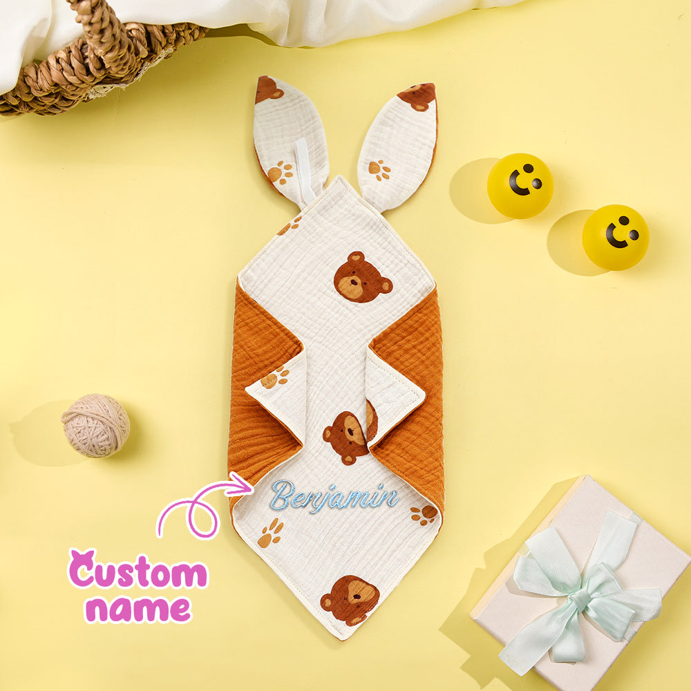 Embroidery detail showing exact name placement on the baby comforter.