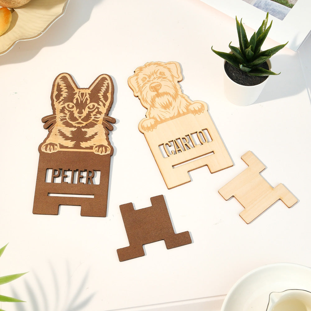 Close-up of personalised pet portrait engraving on wood phone stand
