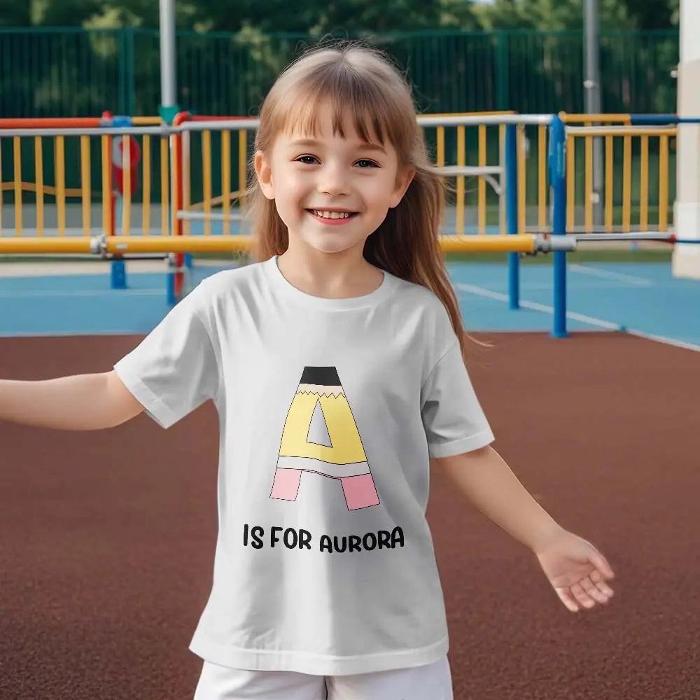 Personalised pencil t‑shirt displayed on hanger with custom name example — perfect for gifts for classmates and school keepsakes