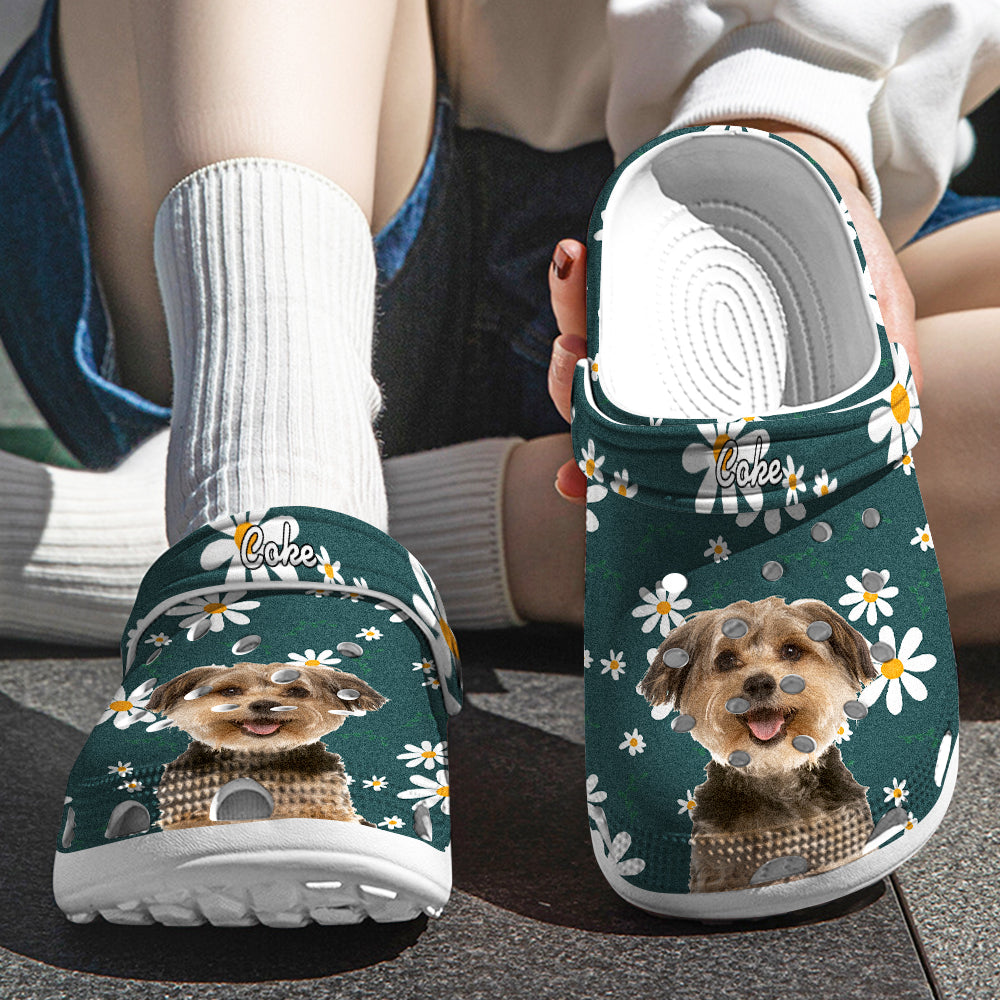 Angled view of personalised pet face clogs showing floral pattern, pet photo on the toe and the custom name on the strap