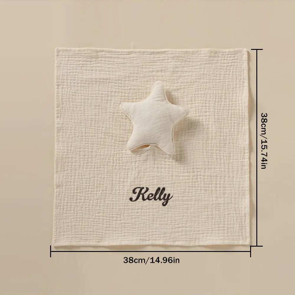 Personalised baby towel laid flat to show full star pattern and placement of embroidered name, perfect newborn keepsake