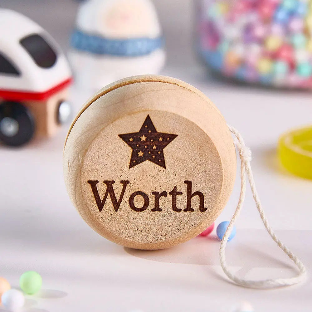 Gift-wrapped personalised wooden yo-yo presented as a thoughtful birthday present and family keepsake