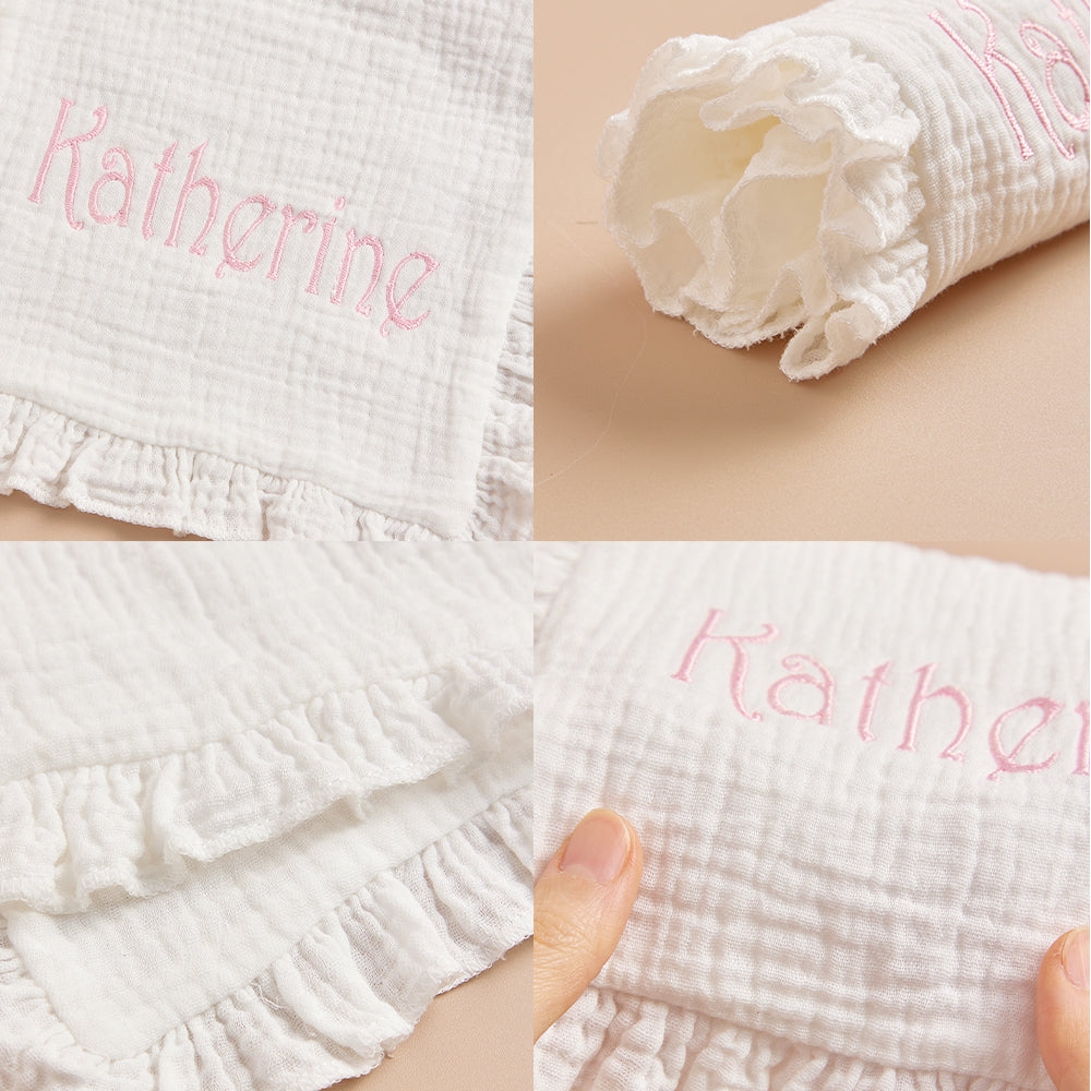 Close-up of embroidered name on the baby towel, showcasing precise stitching.