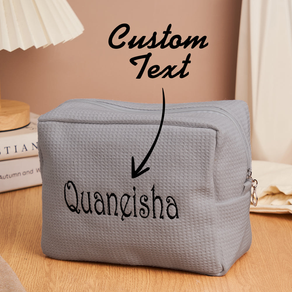 Close-up of embroidered personalisation on waffle make-up bag, an ideal thoughtful gift for her