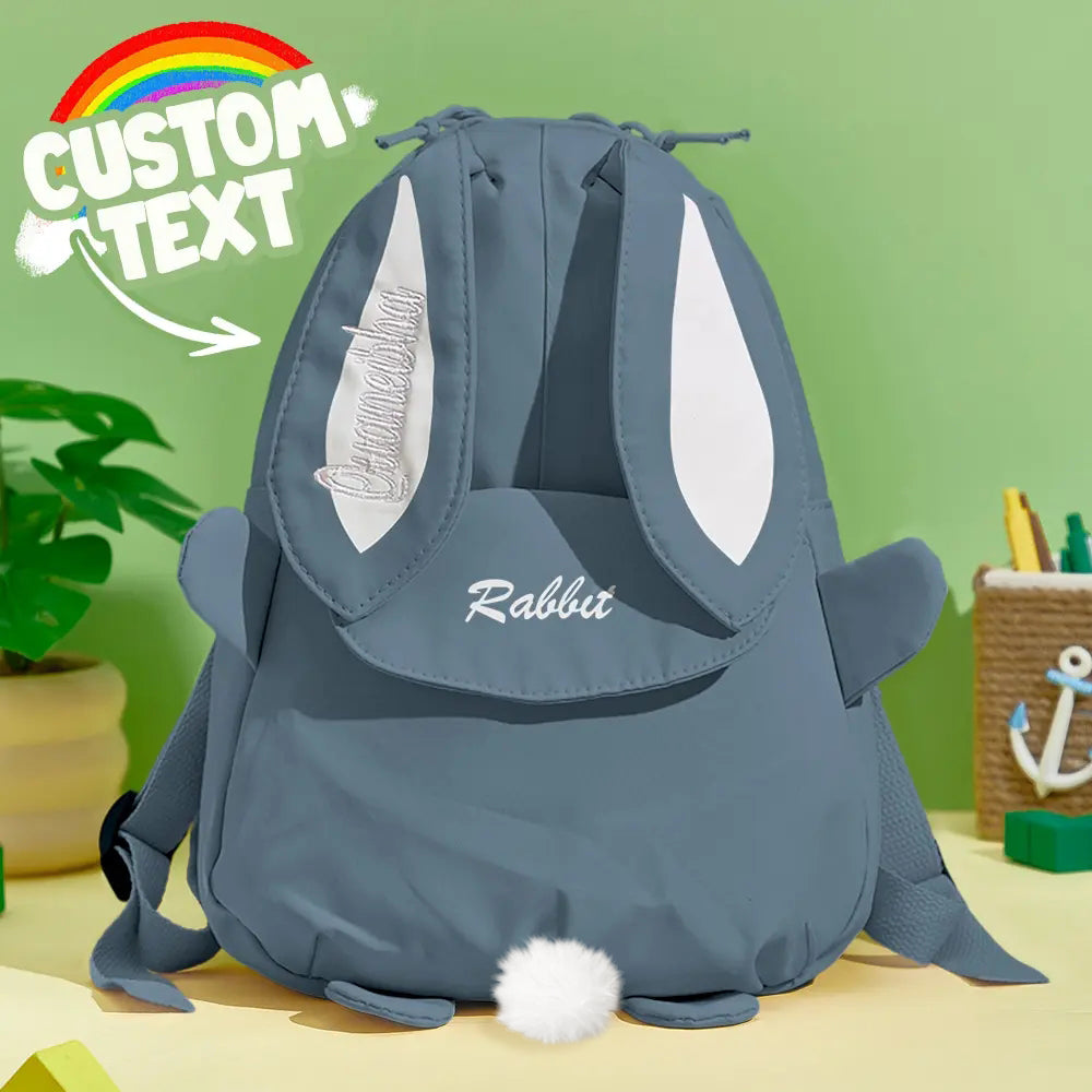 Close‑up of embroidered name on personalised mini rabbit backpack showing neat stitching and durable nylon texture, ideal custom kids school rucksack detail