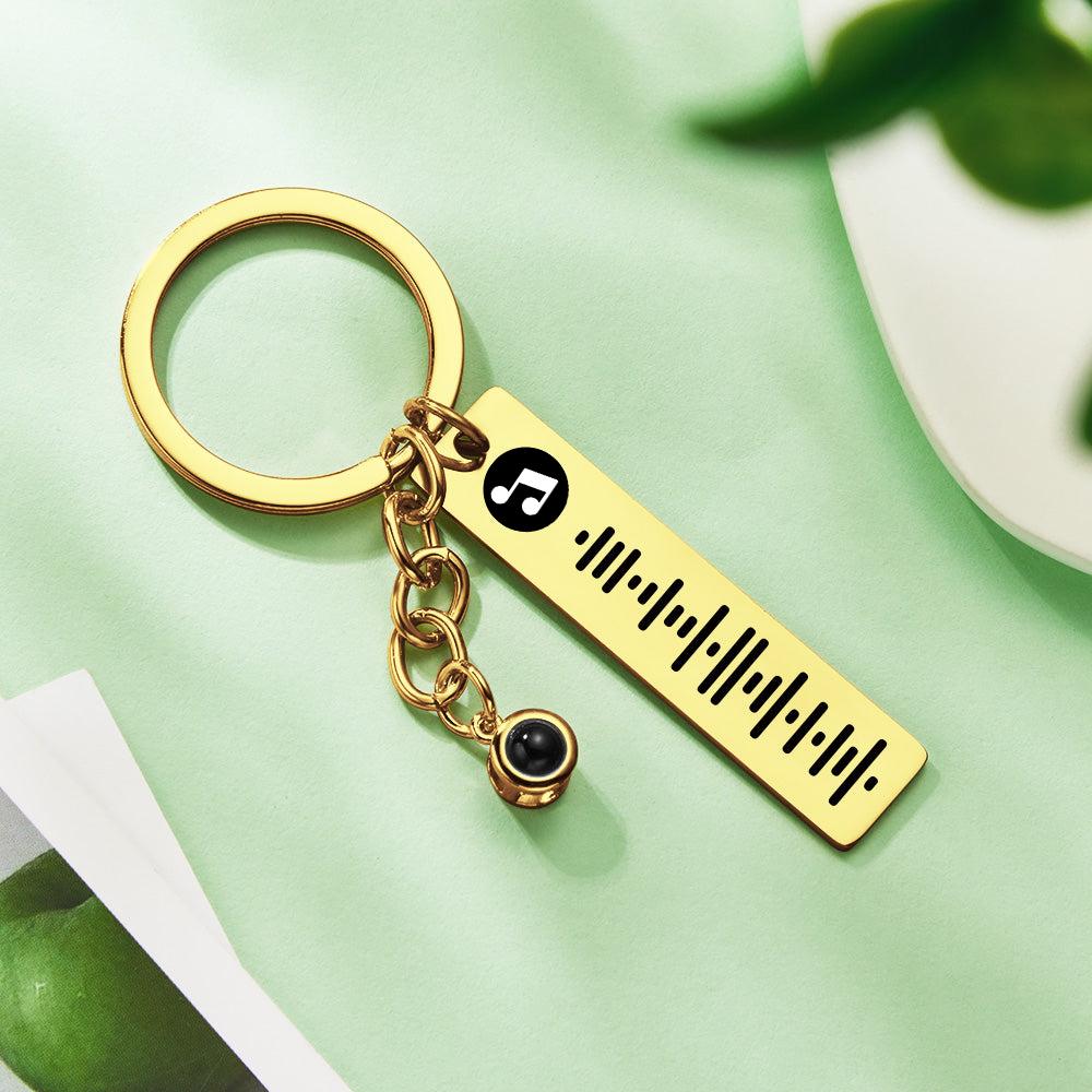 Reverse view showing metal plaque finish and key ring attachment of personalised projection music keychain