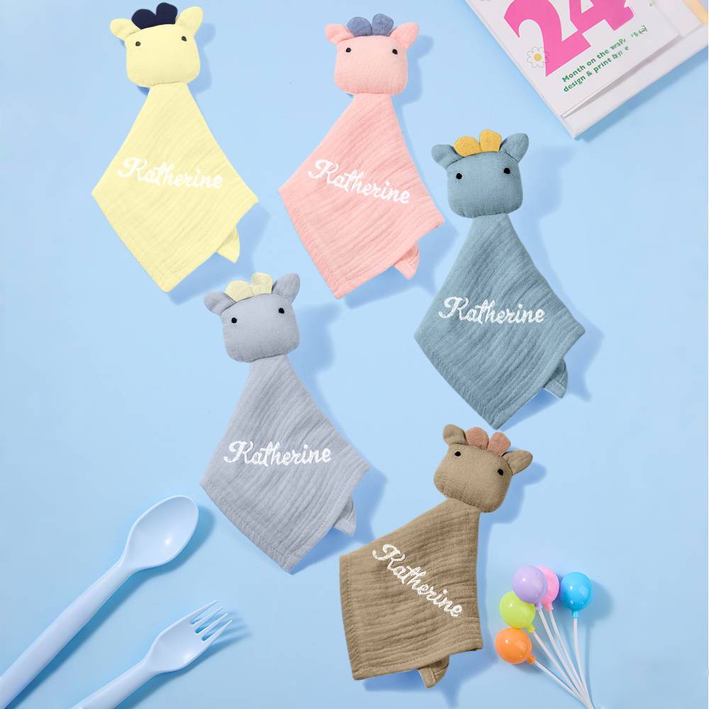 Folded personalised embroidered comforter presented as a newborn gift Australia, soft cotton security blanket