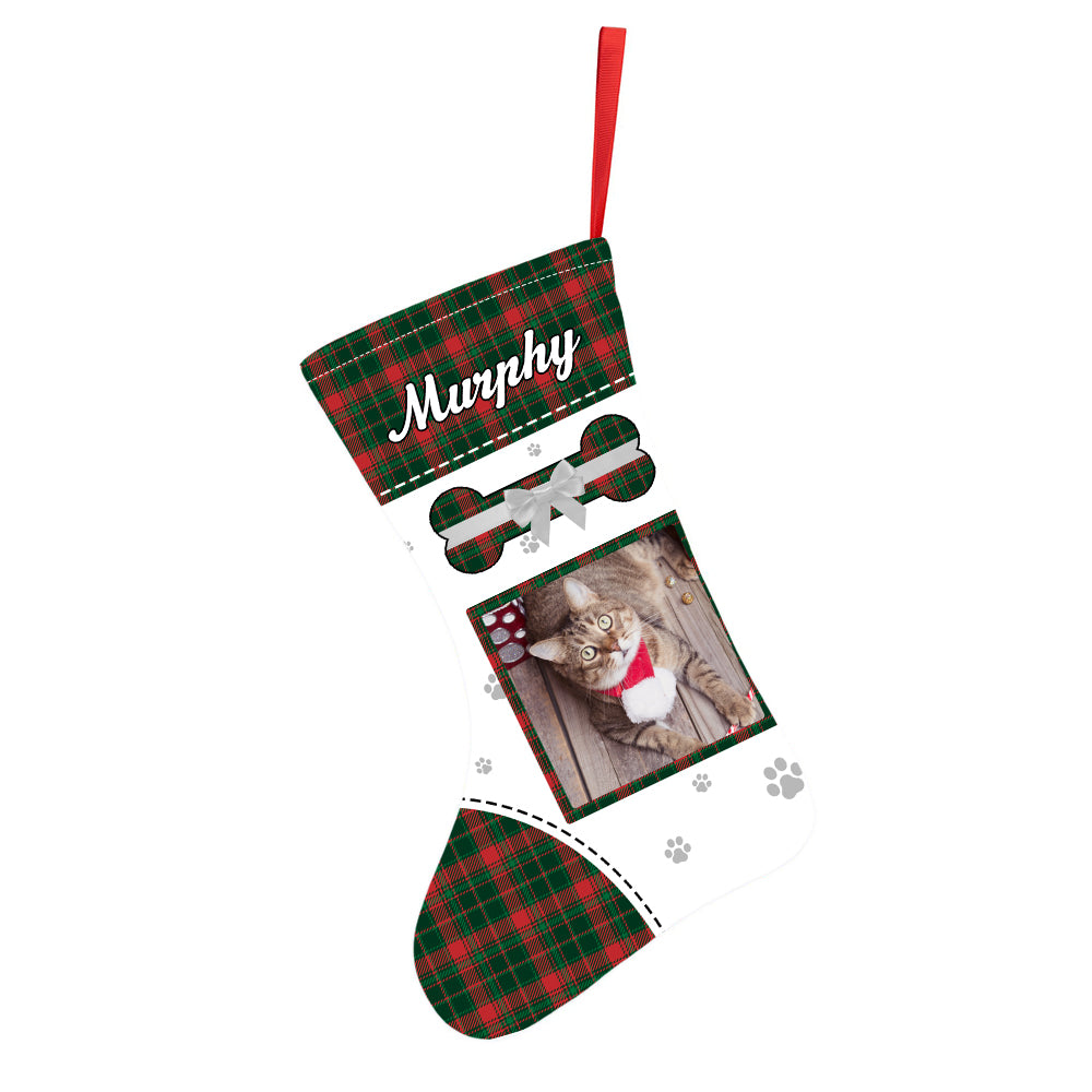 Personalised velvet pet stocking hanging on a mantelpiece, displaying a clear pet photo print and bespoke name in festive colours