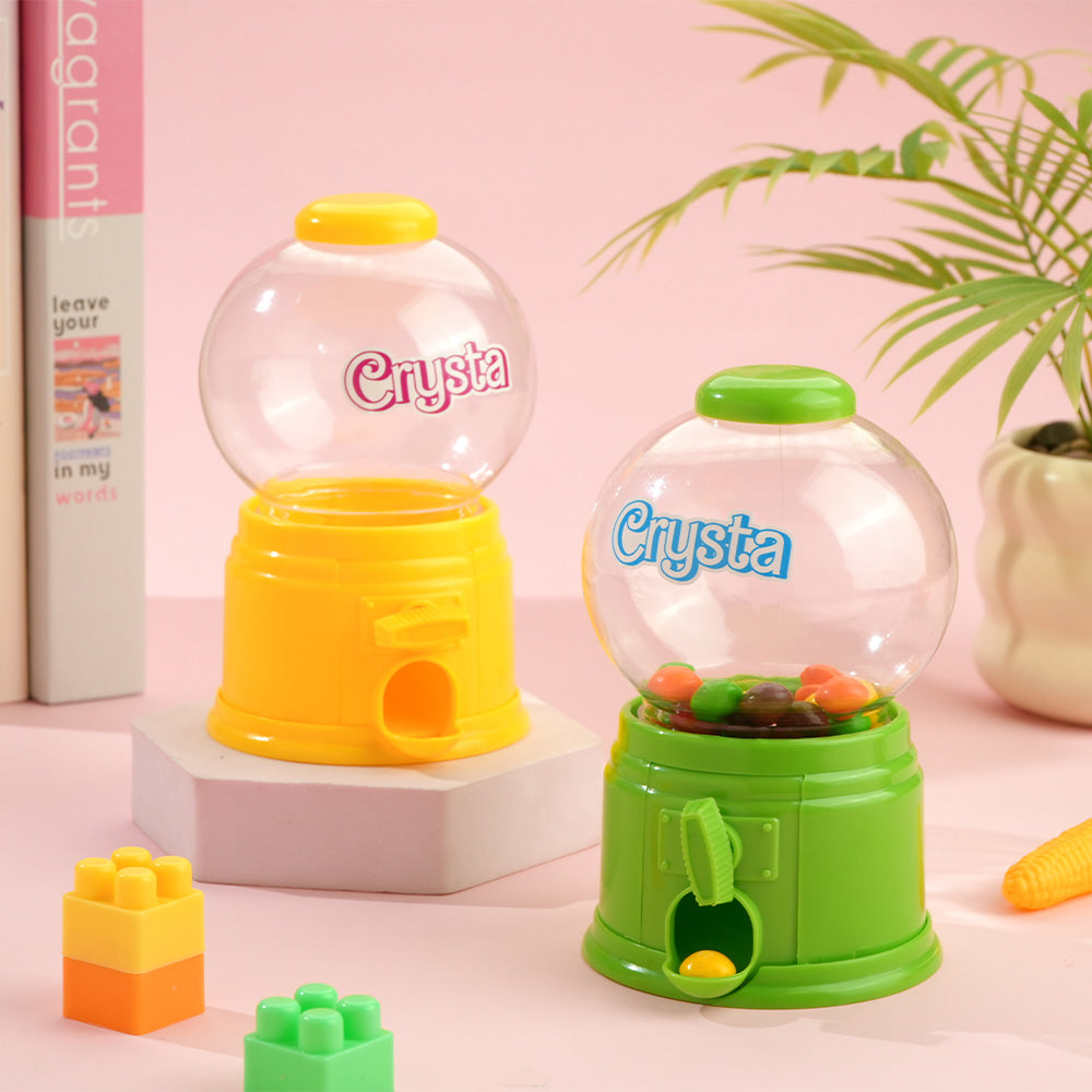 Child enjoying a personalised mini gashapon candy dispenser - hands-on party toy suitable for ages 3+ and supervised play