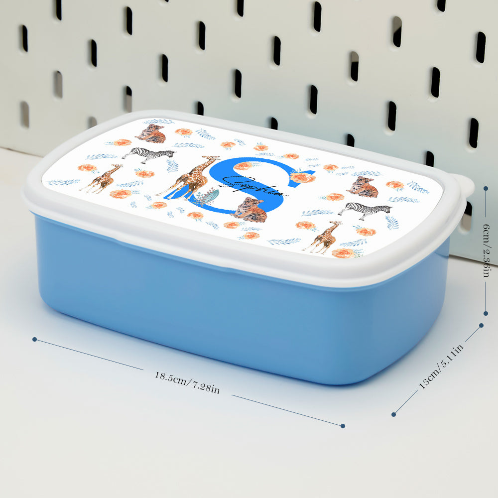 Child holding personalised animal lunch box with name on lid — cheerful back-to-school lunchbox and birthday gift idea