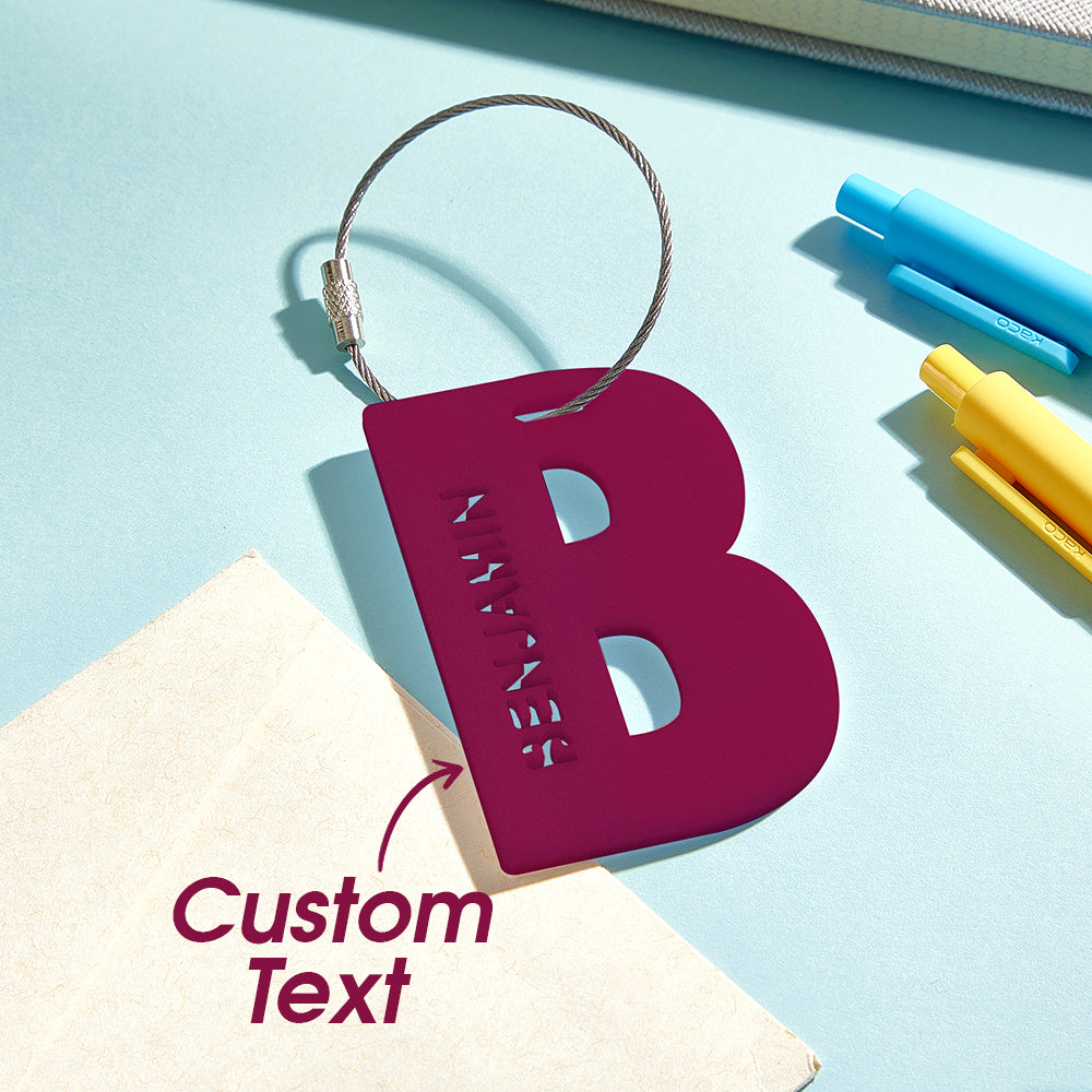Size reference of personalised acrylic name tag approx. 7cm x 5cm beside a backpack strap, lightweight yet robust for daily school use