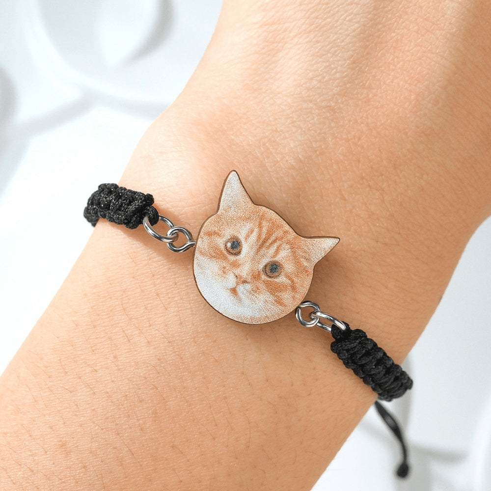 Front view of pet portrait pendant on adjustable braided rope bracelet