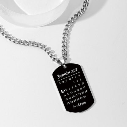 Model wearing black engraved dog tag necklace — personalised photo and calendar keepsake on a non-adjustable 45 cm chain, suitable for men and women