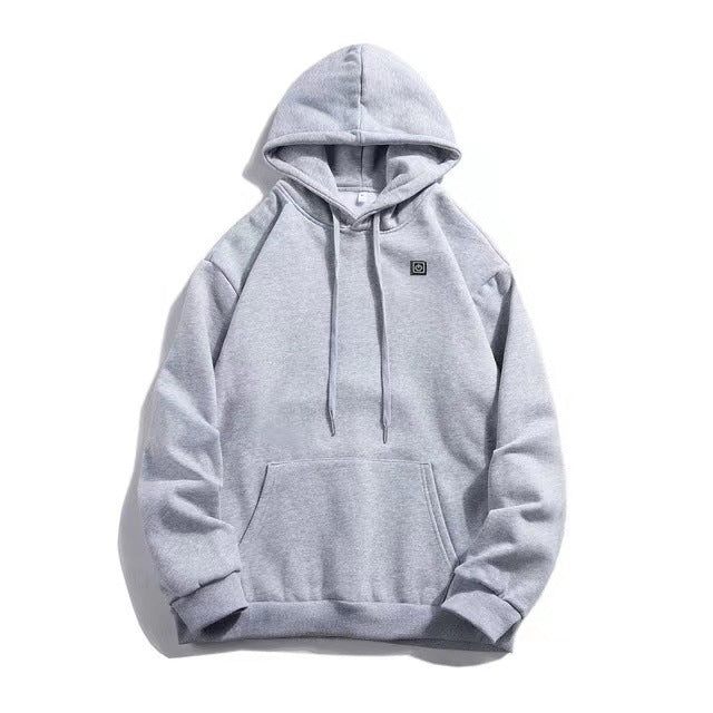 Detail view of hoodie pockets and zipper with discreet integrated heating panels — practical design for a unisex thermal sweatshirt