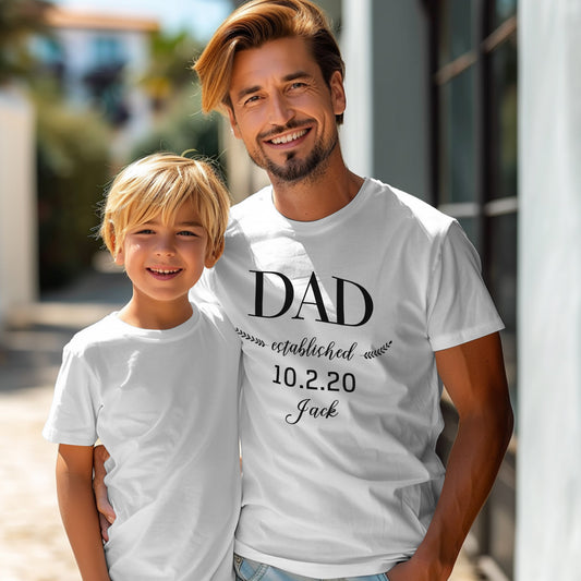 Front view of personalised Daddy Established cotton T-shirt in white – custom Father's Day gift with option to add name or date