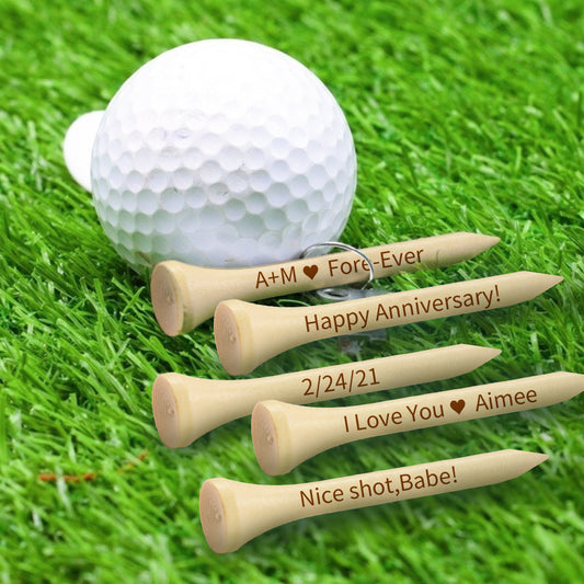 Set of personalised engraved bamboo golf tees on a white background, laser-engraved text and patterns — custom golf gifts