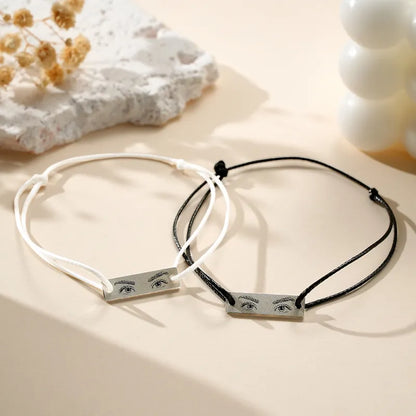 Detailed macro of the engraved iris showing high-resolution micro-engraving on personalised eyes photo bracelet charm