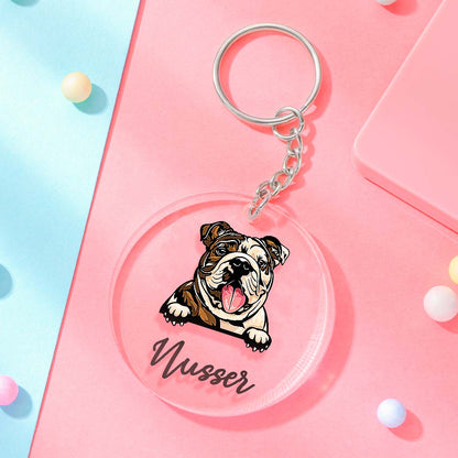 Hand holding a 5cm personalised acrylic dog keyring to show scale with colour‑fast printed cartoon dog and custom name ideal custom name keychain for dog lovers