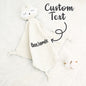 Personalised cotton comforter hanging in a nursery with embroidered name visible — a gender-neutral nursery essential made from soft premium cotton