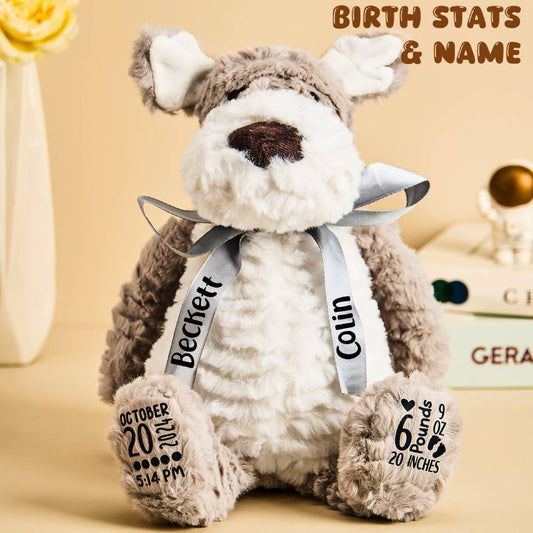 Personalised puppy dog plush (35 x 20 cm) front view showing embroidered birth stats (name, date, time, weight, length) — soft cuddly birth announcement keepsake for newborns